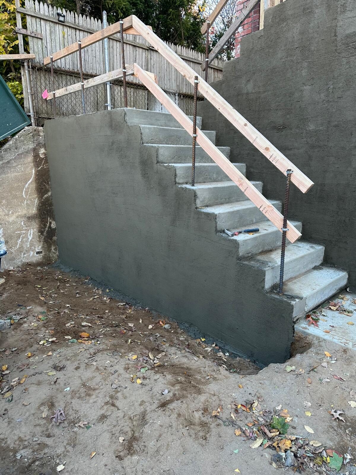 Concrete steps with handrail bracing - Nassau County
